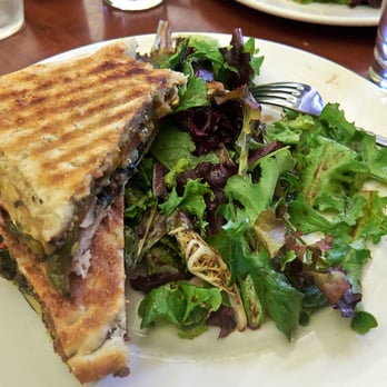 The Jazzcaffè - Mediterranean panini (with a shameless bite already taken), salad. Perfect little lunch in a cool and secluded space. - New American Near Me - Berkeley, California