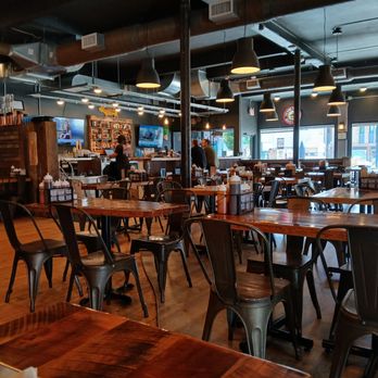 Molasses Smokehouse and Bar - Interior bar and dining area. Stylish industrial theme interior. - Barbeque Near Me - Midland, Michigan Molasses Smokehouse and Bar - Interior bar and dining area. Stylish industrial theme interior. - Barbeque Near Me - Midland, Michigan