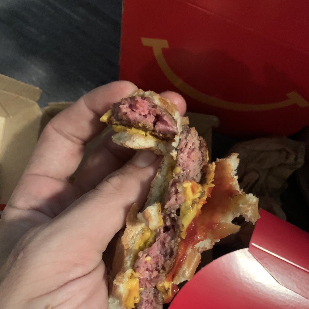 McDonald's - a hand holding a half eaten sandwich - Fast Food Near Me - Lindenwold, New Jersey McDonald's - a hand holding a half eaten sandwich - Fast Food Near Me - Lindenwold, New Jersey