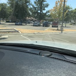 a view of a parking lot from inside a car