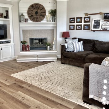 DP Floor Covering - a living room with a fireplace - Flooring Near Me