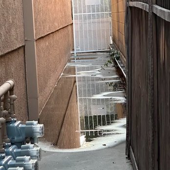 WCD Masonry - Before.  No drainage and old wood fence in poor shape. - Masonry/Concrete Near Me - Long Beach, California