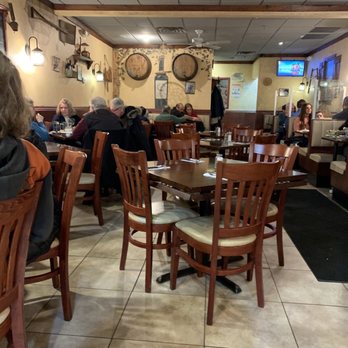 Mykonos Greek Restaurant - people sitting at tables - Greek Near Me - Smithtown, New York Mykonos Greek Restaurant - people sitting at tables - Greek Near Me - Smithtown, New York