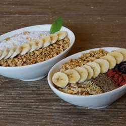 Kale Me Crazy - Acai Bowls can be ordered as Regular or Deluxe versions.  Both are served with gluten free granola.