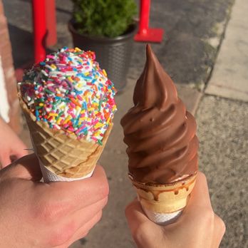 Dairy Mat - two people holding ice cream cones with sprinkles - Ice Cream & Frozen Yogurt Near Me - Birmingham, Michigan