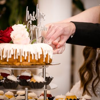 Nothing Bundt Cakes - a bride and groom cutting a cake - Bakeries Near Me - Deerfield, Illinois