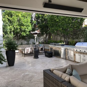 Dreamscapes by MGR - Fire table in the distance doubles are a tabletop for daytime entertaining. - Pool & Hot Tub Service Near Me - Costa Mesa, California