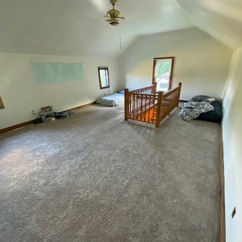 Floors at Your Door - an empty room with a staircase - Flooring Near Me - Jamestown, New York Floors at Your Door - an empty room with a staircase - Flooring Near Me - Jamestown, New York