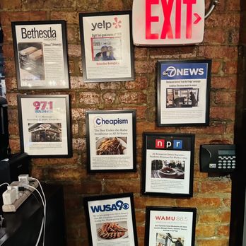 Medium Rare - a brick wall with a bunch of posters on it - Steakhouses Near Me - Washington, DC, District of Columbia Medium Rare - a brick wall with a bunch of posters on it - Steakhouses Near Me - Washington, DC, District of Columbia
