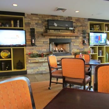Bear's Best - Th fireplace and TVs along the wall in the dining room. - Golf Near Me - Las Vegas, Nevada