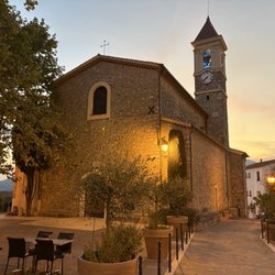 Chez Michel - Village Church next to outdoor seating area
