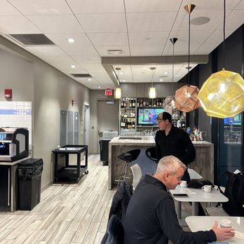 Escape Lounge - two men sitting at the counter - Airport Lounges Near Me - Windsor Locks, Connecticut Escape Lounge - two men sitting at the counter - Airport Lounges Near Me - Windsor Locks, Connecticut