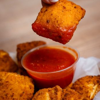 Mario's Pizza - Dunking some fried ravioli in deliciousness - Pizza Near Me - Clemmons, North Carolina Mario's Pizza - Dunking some fried ravioli in deliciousness - Pizza Near Me - Clemmons, North Carolina