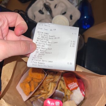 Wendy's - a receipt being held over a bag of food - Burgers Near Me - Huntington Beach, California