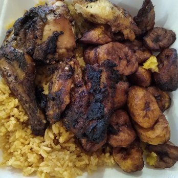 La Fromentine - Half chicken meal with jollof rice and plantains. I think they raised the prices, it was $11.99 on the menu, but I was charged $13.99. - African Near Me - Ottawa, Ontario