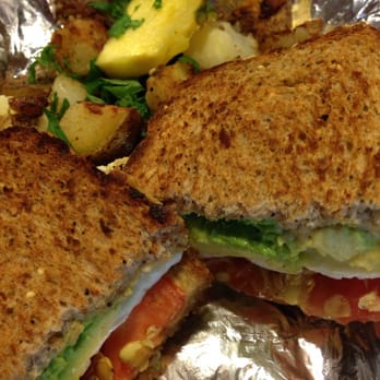 Dancing Avocado Kitchen - Avocado, egg, hummus, sprouts, whole wheat bread. Hash browns&a pineapple slice to seal the deal. - Mexican Near Me - Daytona Beach, Florida