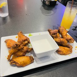 The Draft Room At Berwick - Ten mild jumbo wings, fresh celery, and blue cheese dressing with a Captain Morgan mixed with Pineapple Juice.