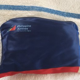 Little bag filled with goodies complimentary of the airline. Little bag filled with goodies complimentary of the airline.