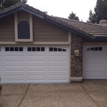 Door Pros - New clopay doors with arched windows on the sides - Garage Door Services Near Me - Folsom, California Door Pros - New clopay doors with arched windows on the sides - Garage Door Services Near Me - Folsom, California