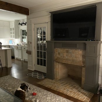Elite Handyman & Remodeling - a living room with a fireplace - Handyman Near Me