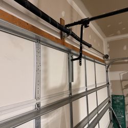HT Garage Door Services - Repaired garage door and bracket support.