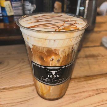 1880 Coffee Company - Caramel drizzle and cold foam on an iced latte at 1880 Coffee Company! - Coffee & Tea Near Me - Crandall, Texas
