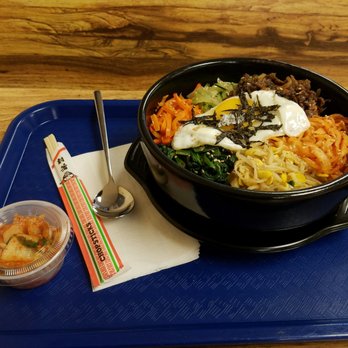 Mona's Gourmet Carry Out - Bibimbap served in hot bowl - Korean Near Me - Odenton, Maryland Mona's Gourmet Carry Out - Bibimbap served in hot bowl - Korean Near Me - Odenton, Maryland