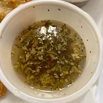 Mommies Empanadas - This is the very vinegary/watery "chimichurri" sauce that comes with the empanadas. I wish the consistency was better. - Food Trucks Near Me - Peachtree City, Georgia