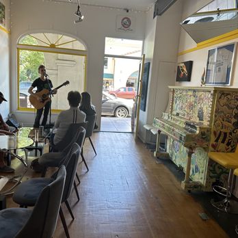 Feros Ferio Winery - a man playing a guitar in a restaurant - Wine Tasting Room Near Me - Ojai, California Feros Ferio Winery - a man playing a guitar in a restaurant - Wine Tasting Room Near Me - Ojai, California