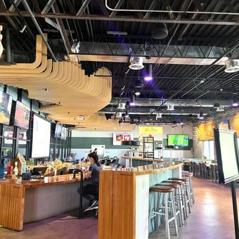 Primrose Lanes - Multiple seating at their cute bar! They play the tennis game  ladies - Bowling Near Me - Orlando, Florida