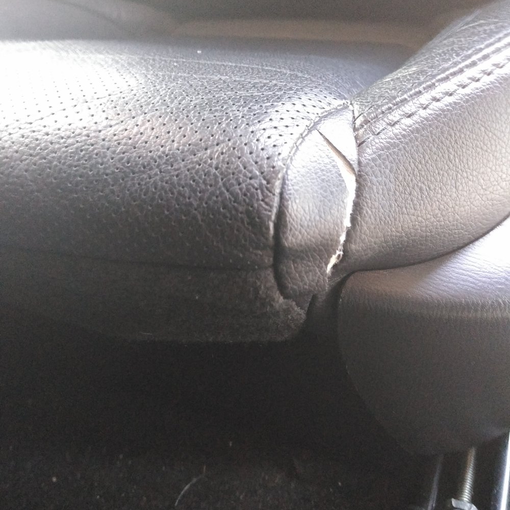 torn vinyl portion of the driver leather trimmed seat, '17 Mazda 3, 1.18.21