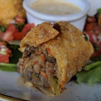 Clear Sky Cafe - Close up of Southwestern Ribeye Eggrolls (shaved ribeye, caramelized onion, pimento cheese, chipotle aioli) - New American Near Me - Clearwater, Florida Clear Sky Cafe - Close up of Southwestern Ribeye Eggrolls (shaved ribeye, caramelized onion, pimento cheese, chipotle aioli) - New American Near Me - Clearwater, Florida