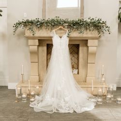 Dannette's Floral Boutique - Greenery on the mantle.