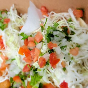 Holé Molé - a close up of a hot dog with toppings - Mexican Near Me - Long Beach, California Holé Molé - a close up of a hot dog with toppings - Mexican Near Me - Long Beach, California