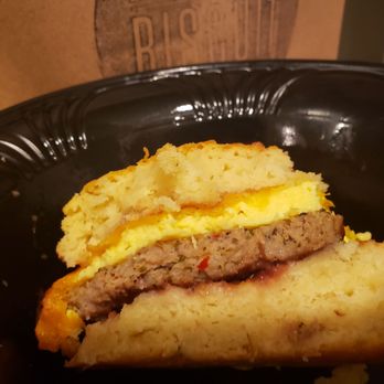 Denver Biscuit Co. - Broadway - Tomahawk biscuit sandwich: sausage, cheddar cheese, scrambled egg and rhubarb jam. Salty, savory, touch of sweet = delicious and indulgent! - Breakfast & Brunch Near Me - Denver, Colorado