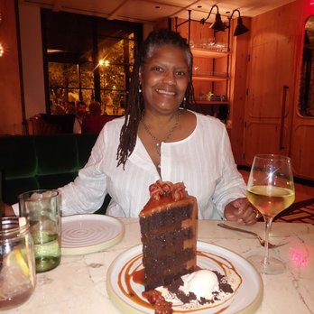 Yardbird - Michelle and the cake with a nice chenin blanc. - New American Near Me - Washington, DC, District of Columbia
