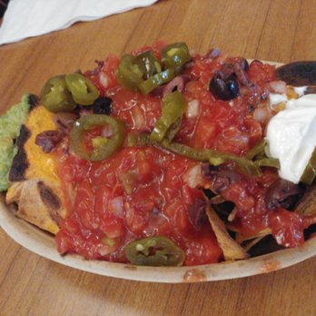 The Boston University Pub - Loaded nachos - $9 as of 9/19.  Unfortunately it wasn't layered well so all the toppings were... only on the top. - Pubs Near Me - Boston, Massachusetts