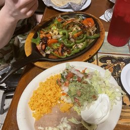 a plate of mexican food on a table