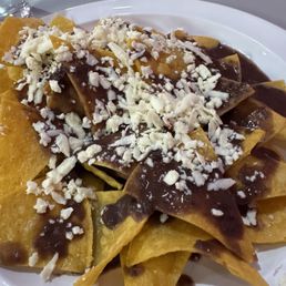 Chips with refried beans. Chips with refried beans.
