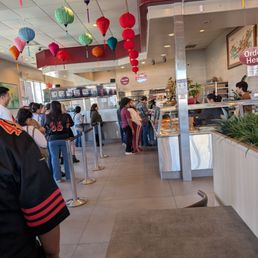 Customers waiting in 1 line for pickups and to place an order. Customers waiting in 1 line for pickups and to place an order.