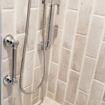 Artisan Home Construction - Integrated hand shower system with flow control. - General Contractors Near Me