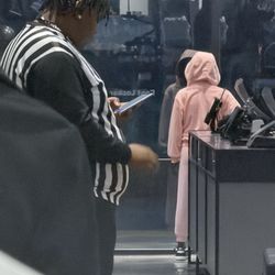 Foot Locker - Photo of Employee on Cell Phone