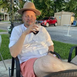 My husband goofing around in my hat at the outside seating. SO FUN! My husband goofing around in my hat at the outside seating. SO FUN!