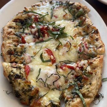 Common Grill - Pesto flatbread w/roasted peppers, mozzarella and Parmesan. - New American Near Me - Chelsea, Michigan