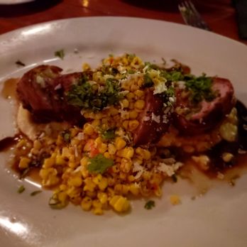 Roaring Fork - Bacon wrapped pork tenderloin with Mexican corn - American Near Me - Austin, Texas
