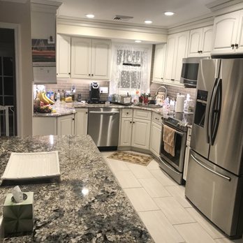 Cary Construction - a kitchen with granite countertops and stainless steel appliances - General Contractors Near Me - North Bellmore, New York Cary Construction - a kitchen with granite countertops and stainless steel appliances - General Contractors Near Me - North Bellmore, New York
