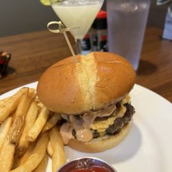 The Burger Place - Smash burger with Cajun fries and a lemon drop martini