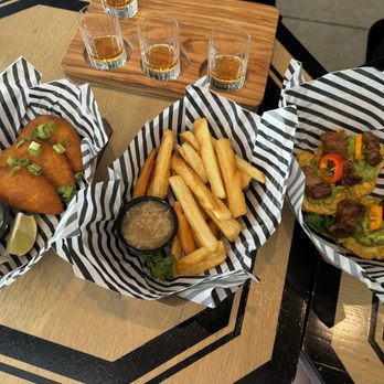 TRU LUV Empanadas & Coffee - Beef empanadas, yucca fries and fried plantains with guacamole and added fried pork belly. :-) - Empanadas Near Me - Austin, Texas