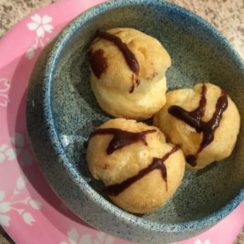 Sushi Station - Cream Puffs drizzled with chocolate sauce and filled with vanilla cream. Soft puffs, served cold. - Sushi Bars Near Me - Rolling Meadows, Illinois