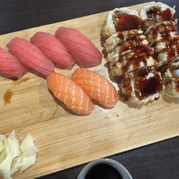 Tuna and salmon sushi and crab and cream cheese sushi roll that is deep fried. They are amazing and delicious Tuna and salmon sushi and crab and cream cheese sushi roll that is deep fried. They are amazing and delicious